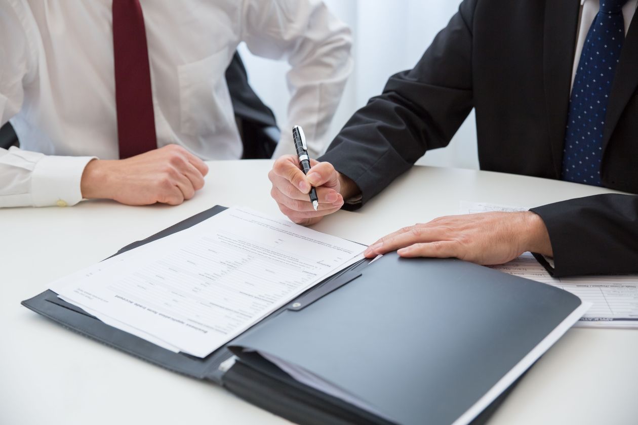 Signing documents at a solicitor’s desk